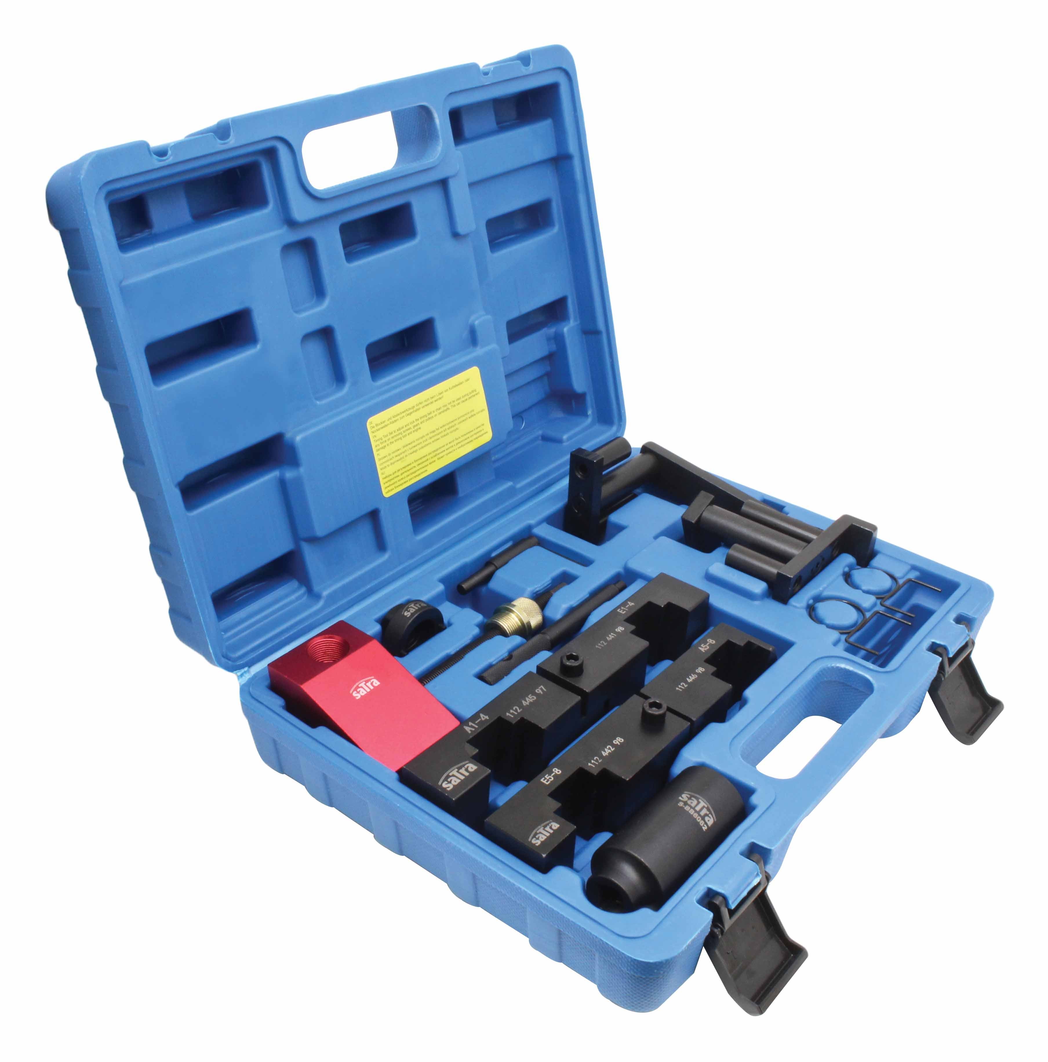 Angled view of blue case with VANOS camshaft timing tools: red block, black locator blocks, pins and brackets