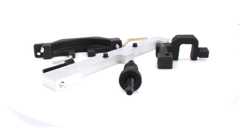 Angled close-up of crossbar, puller bolt and black brackets from a BMW locking tool set